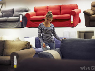 woman-looking-at-sofas-in-furniture-store.jpg