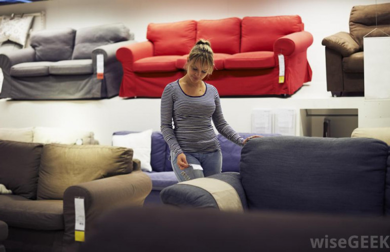 woman-looking-at-sofas-in-furniture-store.jpg