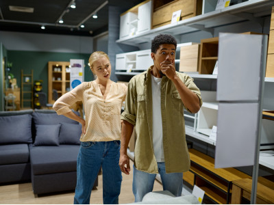 couple-disappointed-with-price-in-furniture-store.jpg