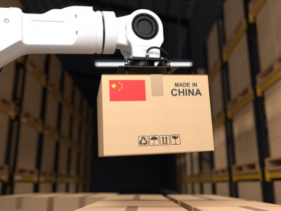 the-robot-arm-picks-up-the-cardboard-box-made-in-china.jpg