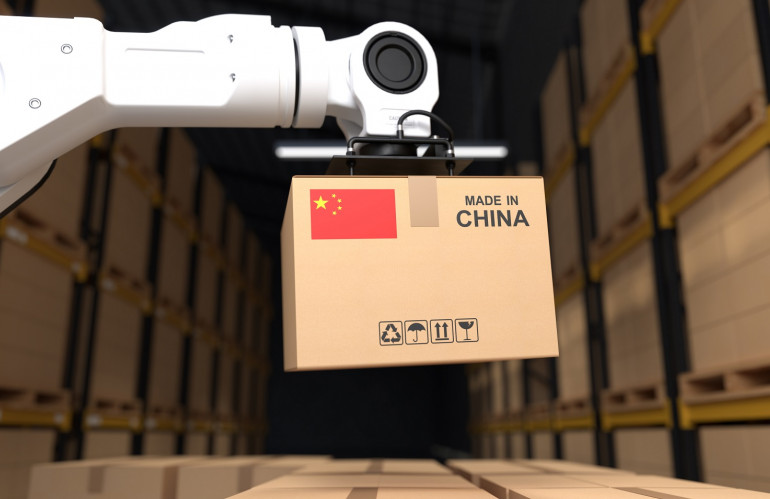 the-robot-arm-picks-up-the-cardboard-box-made-in-china.jpg