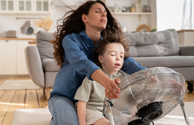 relaxed-mom-small-kid-refreshing-sit-big-indoor-ventilator-blowing-cooling-fresh-air-home.jpg